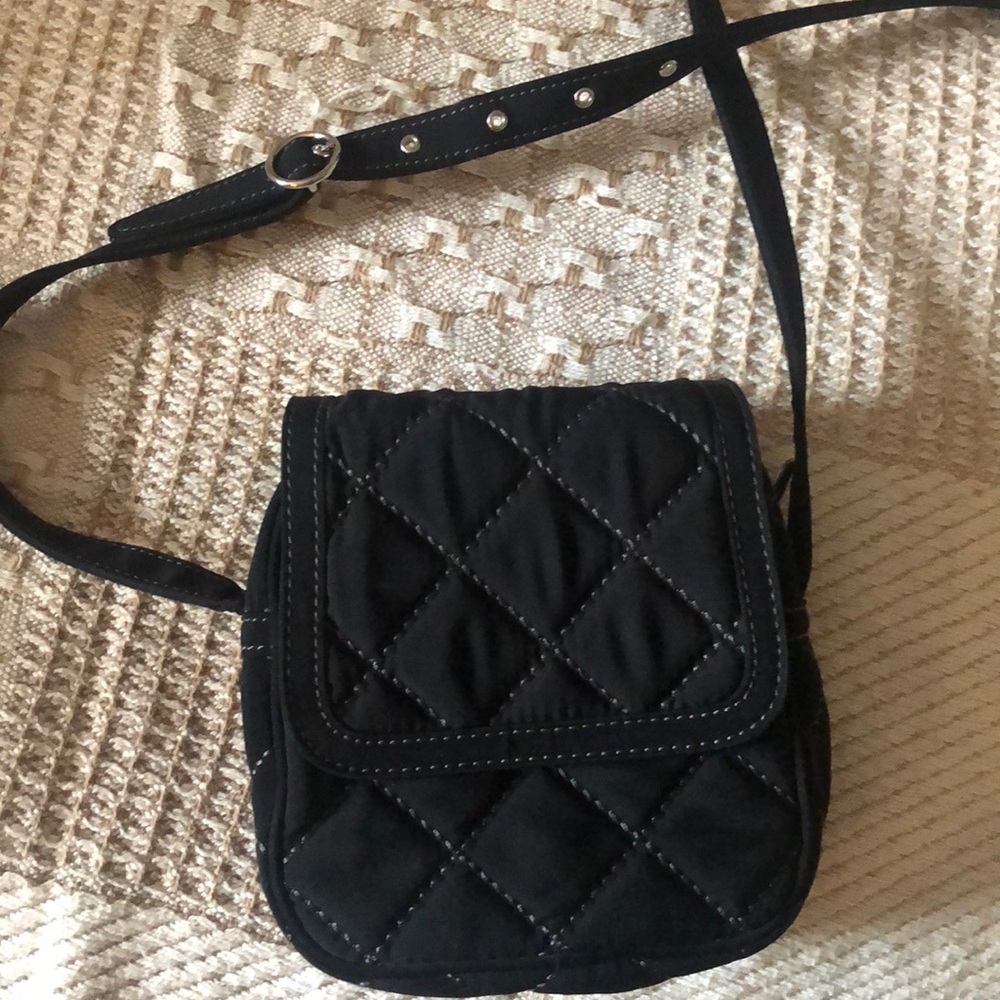 Small Crossbody with adjustable strap. 1 exterior and 1 interior pocket.